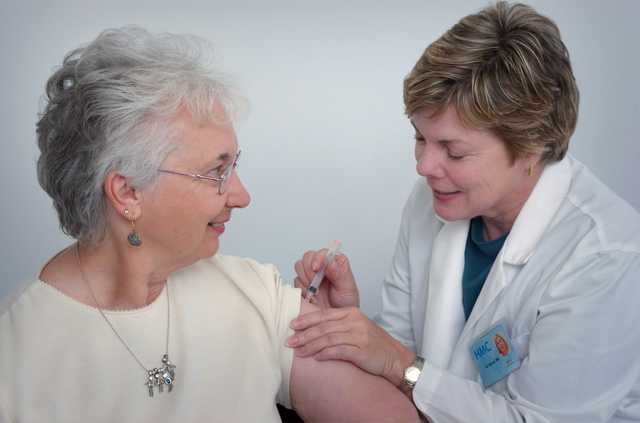 Healthcare professional caring for an older service user